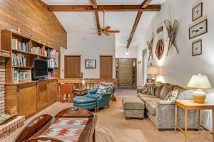 a living room with a couch and a tv at Loonsight in Minocqua