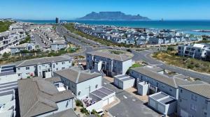 an aerial view of a city with houses and the ocean at Luxurious 2Bed ,Iconic Views Mountain& Beach in Big Bay