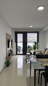 a living room with a couch and a table at Portal Patagónico in Puerto Madryn