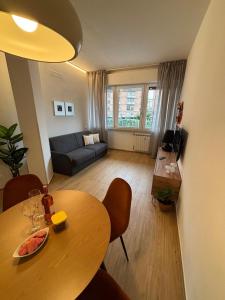a living room with a table and a couch at Lo Spaho Suite Florence in Florence