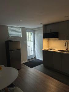 a kitchen with a sink and a counter top at Joshie Stays in Hamilton