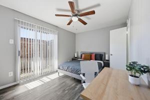 a bedroom with a bed and a ceiling fan at Great 1BR Mid-Term Apartment in Denton +12 photos