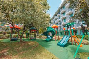 a playground in front of a building with a slide at Itá Thermas Resort e Spa in Itá