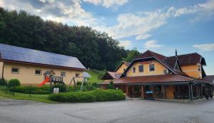a house with solar panels on top of it at Pauza Plac in Žitence