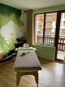 a room with a bench in front of a bedroom at Panorama View in Bansko +31 photos