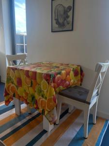a table with a cloth with fruit on it at Het Hunebedje in Vries