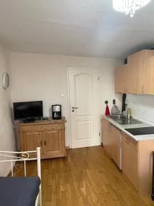 a kitchen with a sink and a counter top at Ad Monte in Cochem