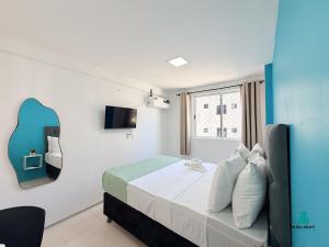 a hotel room with a bed and a tv at Brisa do Mar Residence by Holiday Stays in Fortaleza +95 photos