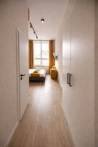 a hallway with a room with a bed and a door at Apart-HOTEL GALLERY 21 in Lviv +34 photos