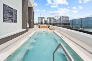 a hot tub on the roof of a building at Downtown Miami Condo w Pool & Great Location in Miami