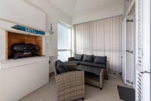 a living room with a couch and a table at SeaView Lovran in Lovran +10 photos