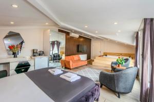 a bedroom with a bed and a living room at Etiz Hotels & Residences in Istanbul