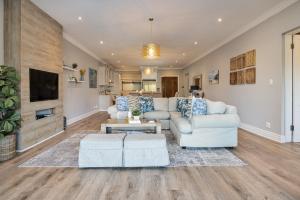 a living room with a couch and a table at 11 Bonabali in Ballito