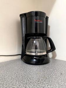 a black blender sitting on top of a counter at Cozy house in the Angelópolis area in La Concepción +14 photos
