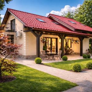a house with a red roof and a patio at Villa DeaDorata in Oradea
