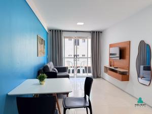 a small living room with a table and chairs at Brisa do Mar Residence by Holiday Stays in Fortaleza
