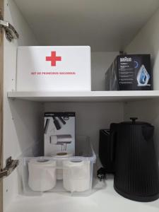 a shelf with a box and two toilets on it at Casinhas da Ajuda nº15 in Lisbon