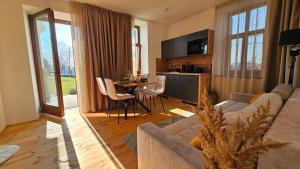 a living room with a couch and a table at Villa Olea in Tihany