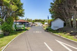 an empty road with a house on the side of the road at Ailsa Seaview in Turnberry