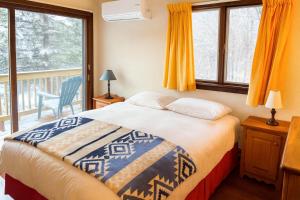 a bedroom with a bed and a balcony at Smugglers Trove in Cambridge +16 photos