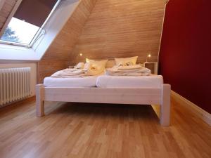 a bedroom with a white bed in a attic at Ferienwohnung in Westerland auf Sylt in Westerland