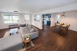 a living room with a couch and a table at The Downtown Cedar in Ocean Springs