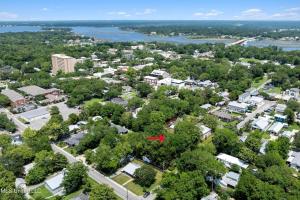 an aerial view of a town with trees and buildings at The Downtown Cedar in Ocean Springs +1 photo
