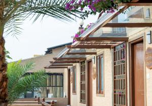 a building with flowers on the side of it at Resotree in Talai
