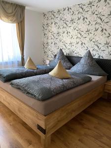 a bed with two pillows on it in a room at Apartment Saxonia in Pirna