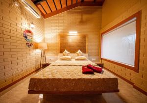 a bedroom with a bed and a large window at Resotree in Talai +40 photos
