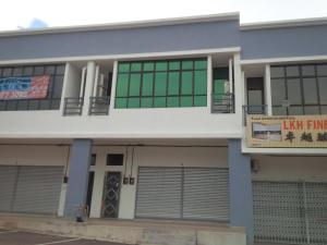 a building with a sign in front of it at Eiman Homestay, Kluang in Kluang