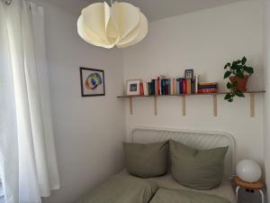 a living room with a couch and a chandelier at Zum alten Pasewalker Kaufmann in Pasewalk +4 photos