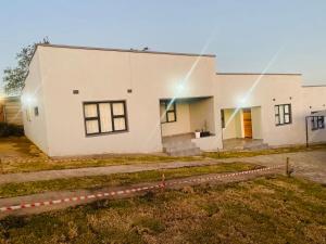 a white building with a lot of windows at Lubelo Close in Mbabane