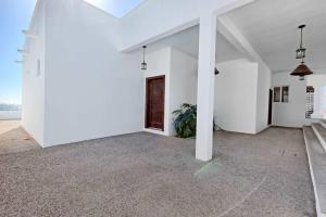 an empty room with white walls and a door at Luxury & Spacious Beachfront Home Casa Espiritu in Puerto Peñasco