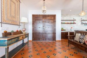 a living room with a wooden door and a table at Luxury & Spacious Beachfront Home Casa Espiritu in Puerto Peñasco +68 photos