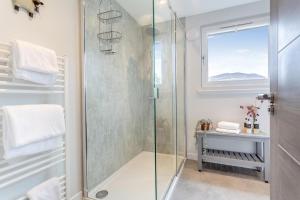 a shower in a bathroom with a glass shower stall at 3 Bed in Ullapool oc-s33063 in Ullapool +32 photos