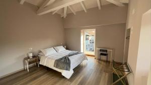 a bedroom with a large bed and a window at Da Teo & Lisa in Vignone