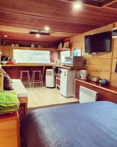 a room with a bed and a kitchen in a room at Little T in Yarra Junction