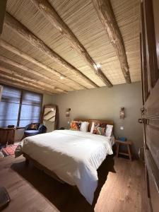 a bedroom with a large bed in a room at Skarchan Resort Skardu in Skardu