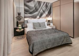 Ascott Orchard Singapore客房内的一张或多张床位