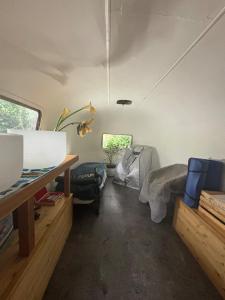 a small room with a bed and a table at Stay and Spa in Sooke