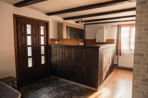 a kitchen with a wooden counter in a room at Zen Home in Mihai Viteazu