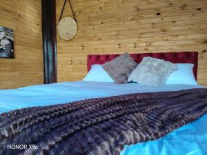 a bedroom with a bed with a large blanket at Oluhle Resort in Hammanskraal +26 photos
