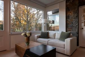 a living room with a couch and a table at Windlestraw Guesthouse in Walkerburn