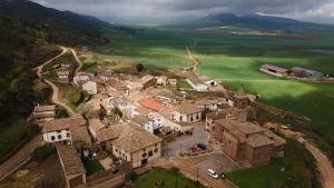 an aerial view of a small village with houses at Casa Mila in Etayo