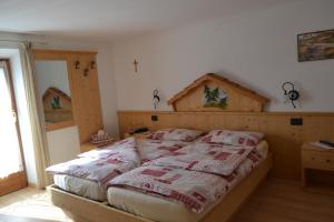Кровать или кровати в номере Albergo Aurora