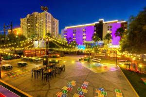 a city at night with lights and tables and buildings at Oasis at Gold Spike in Las Vegas