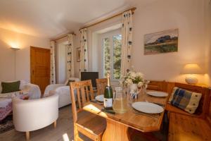 a living room with a wooden table and chairs at Résidence Bel'Alp in Chamonix