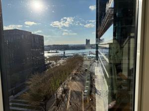 a view of a city from a window of a building at Luxe Apartment with Harbor views in Baltimore