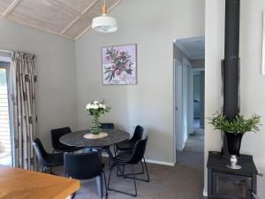 a dining room with a table and chairs at Sunny Clyde Getaway in the Heart of Clyde in Clyde +2 photos